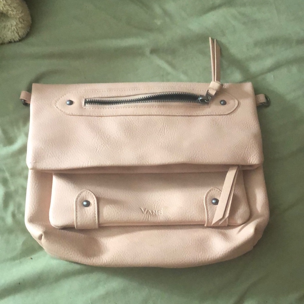 This is a pink kind of coral vans bag